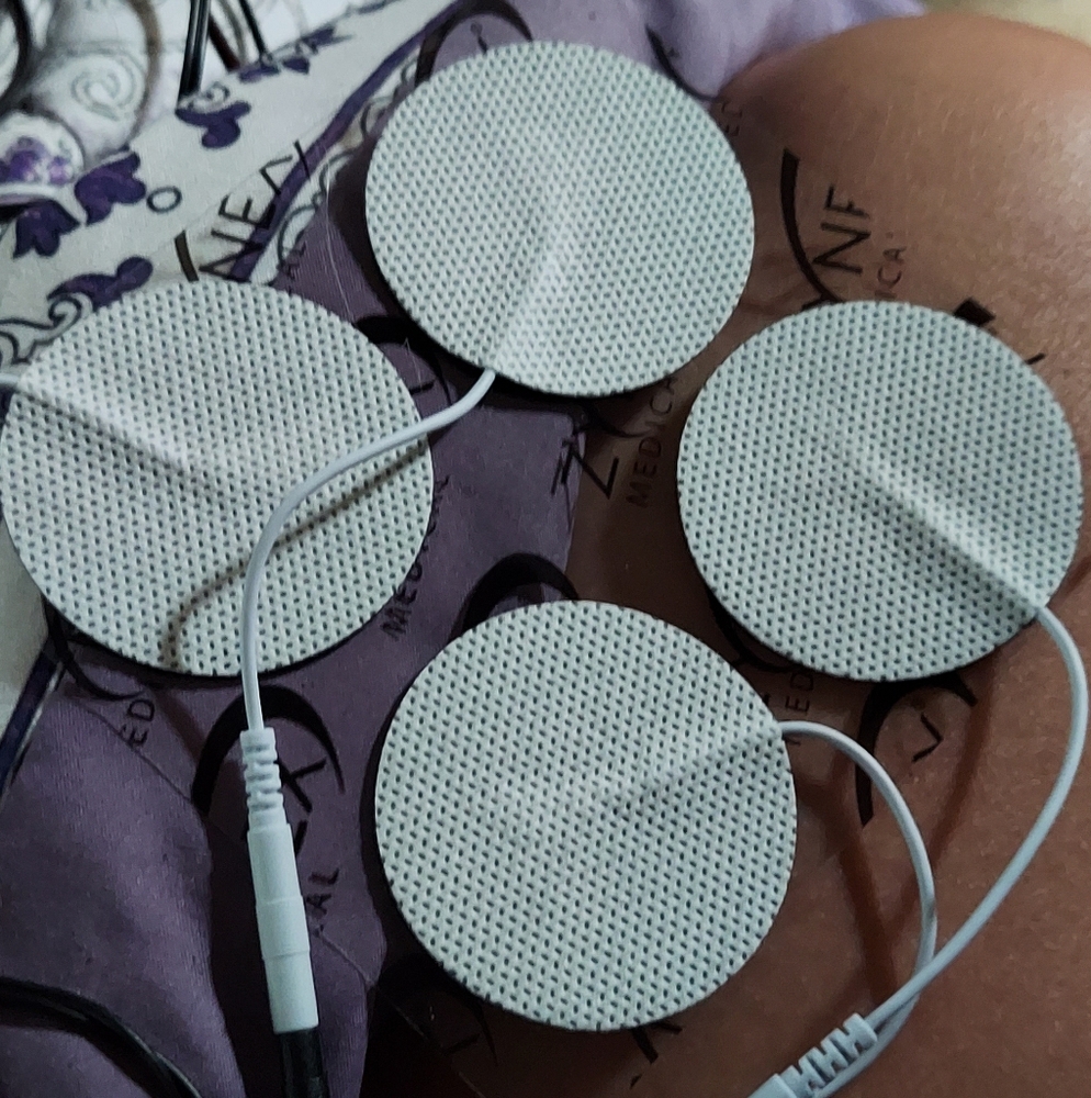 Tens unit with 16 extra electrode Sets. Comes in a hard plastic container.